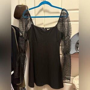 BCBGeneration Black mini dress with Sheer Polka Dot Sleeves